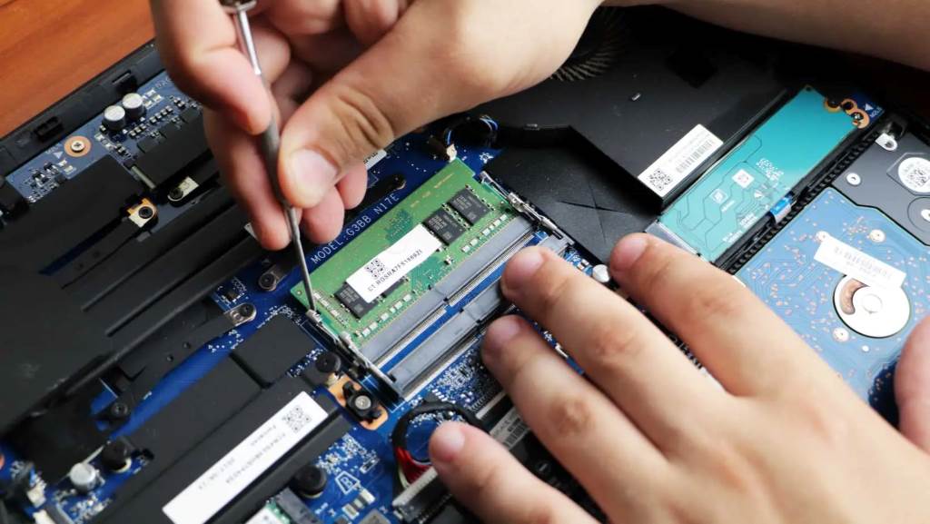 A motherboard showing visible burn marks and corroded connections