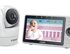 VTech VM901 baby monitor camera unit placed in a cozy nursery overlooking a crib with clear 1080p view